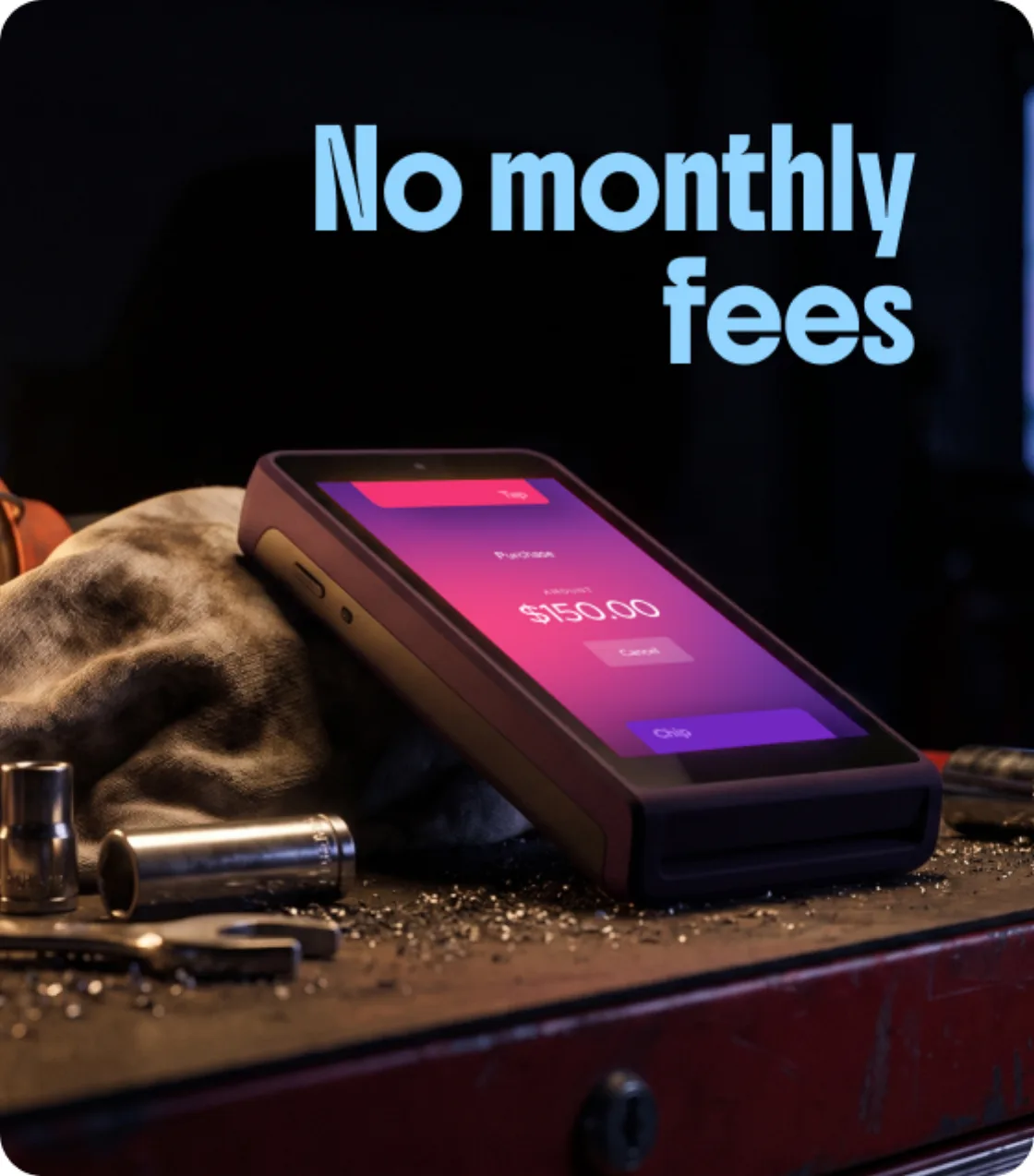 No monthly fees — a Helcim card reader showing a $150.00 payment on a workbench