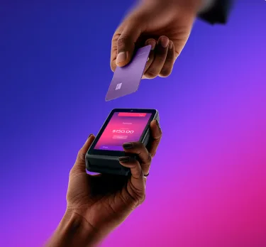 A hand taps a credit card to the Helcim Card Reader showing a $150.00 purchase