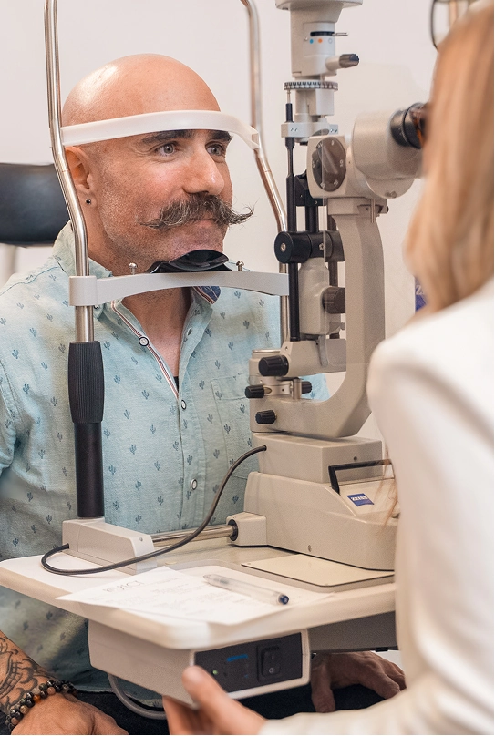 Optometrist processing a card payment with Helcim terminal and practice software