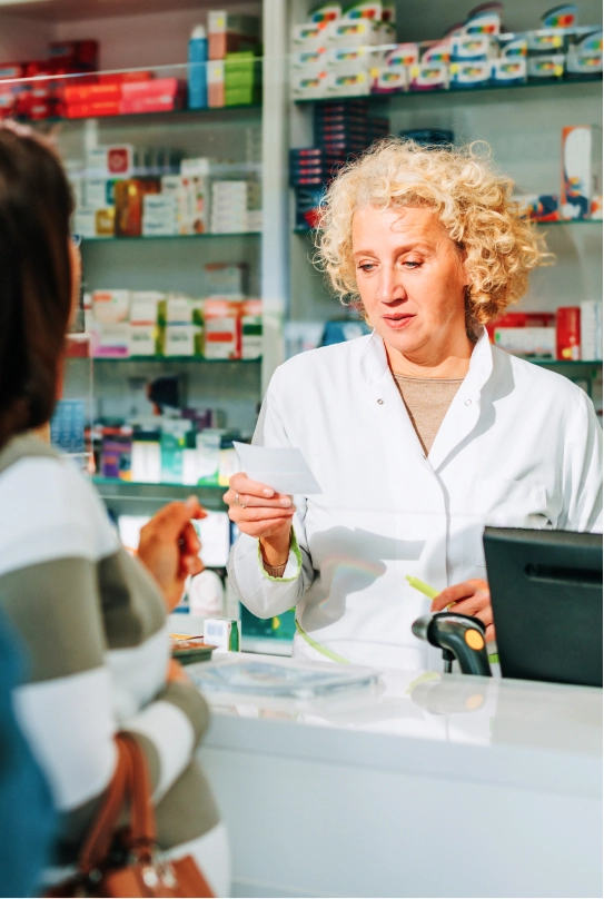 Pharmacy processing a card payment with Helcim terminal and POS system