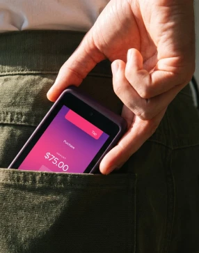 A customer paying with a phone
