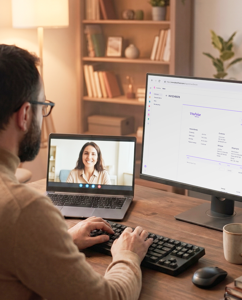 Therapist conducting a teletherapy session while managing invoicing on second screen