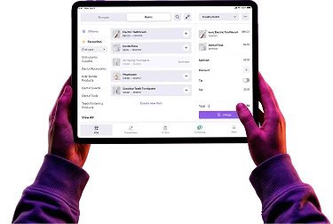 Helcim POS software running on a tablet held in two hands