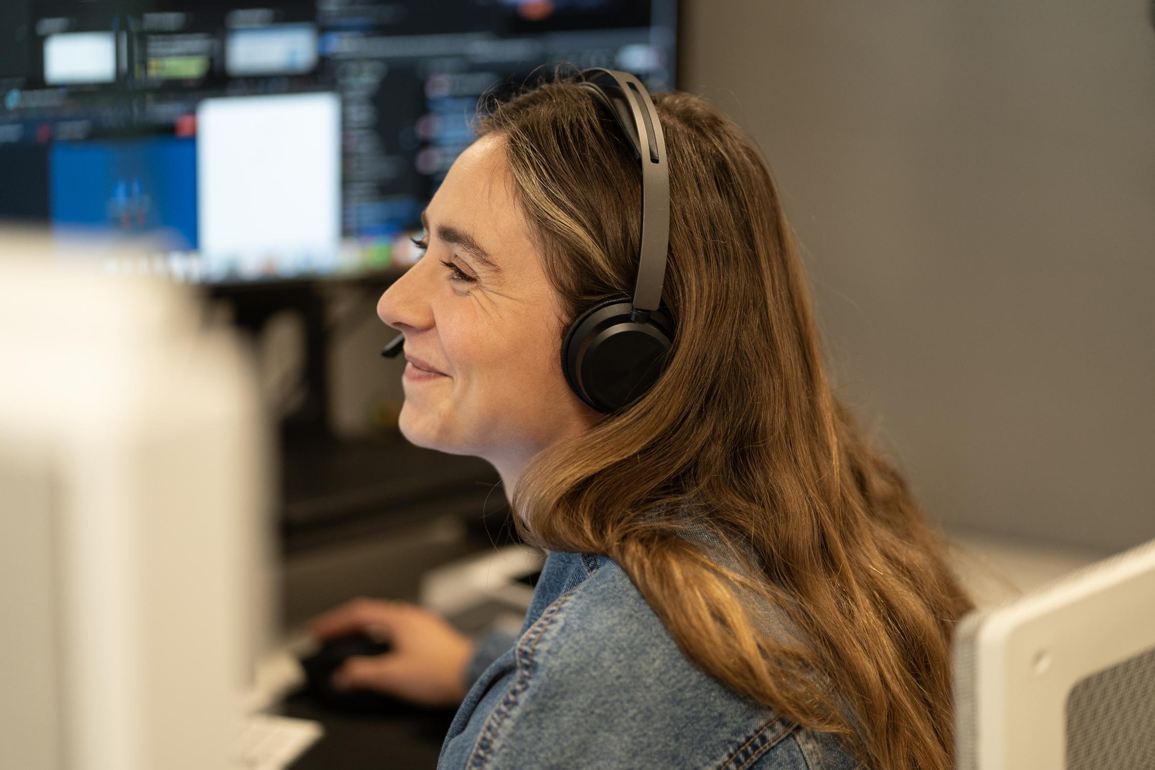 Helcim support team member smiling while helping a customer