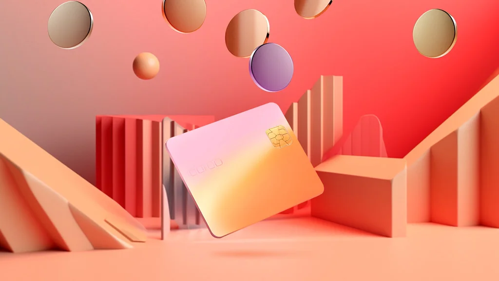 pink and orange image of credit card and coins floating down