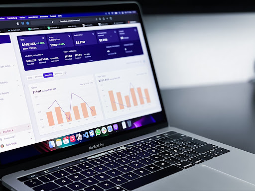 laptop with data dashboard on screen