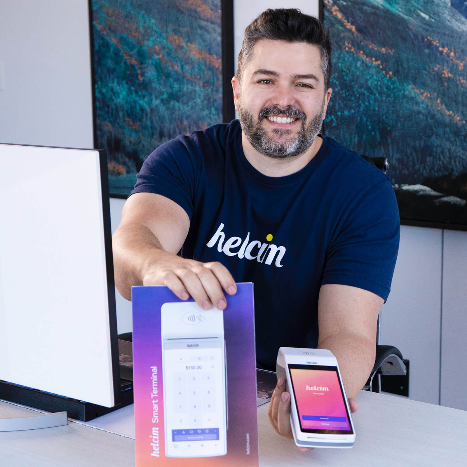 Helcim CEO Nic holding new Smart Terminal Product