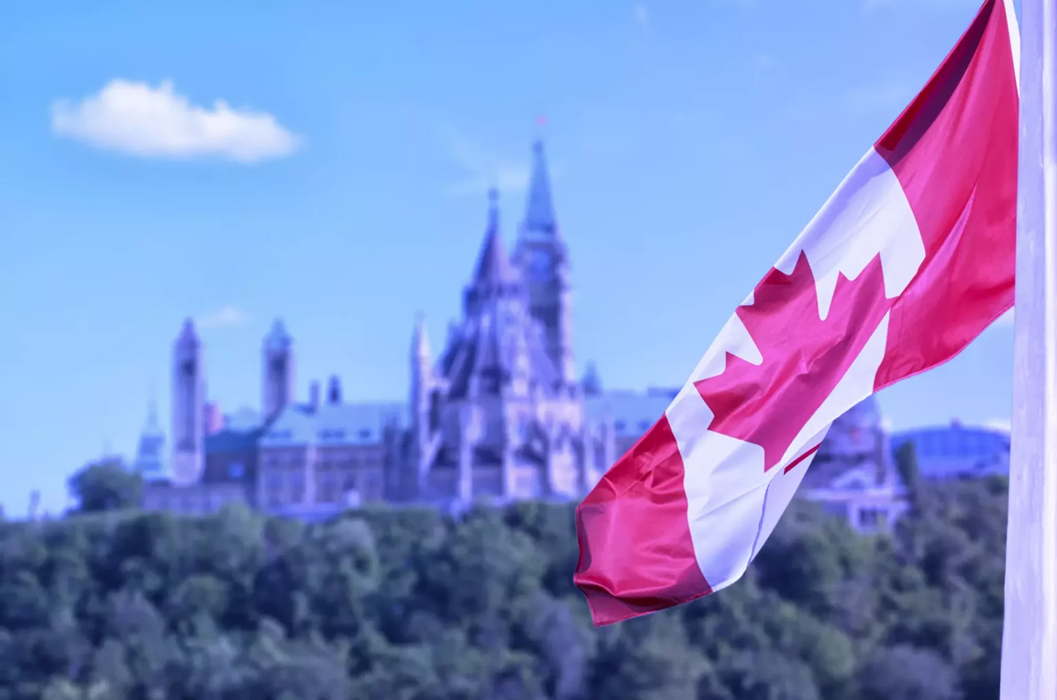 Canadian parliament building with Canadian flag