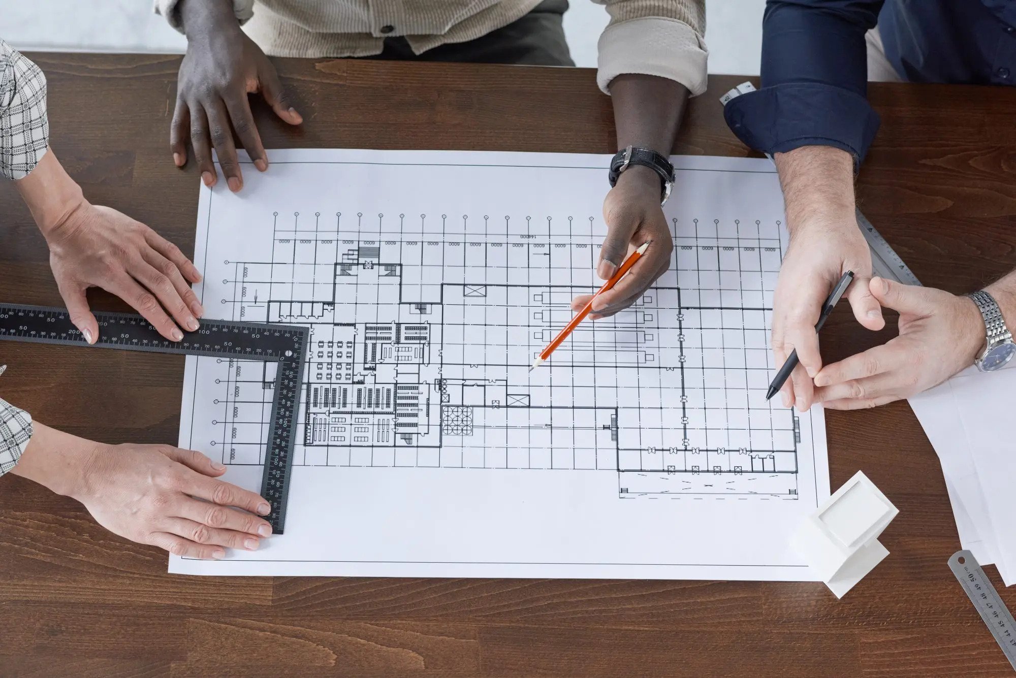 engineers drawing a blueprint