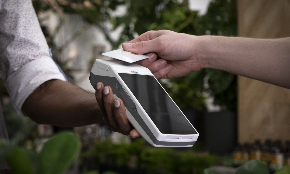 merchant processing a payment on the smart terminal