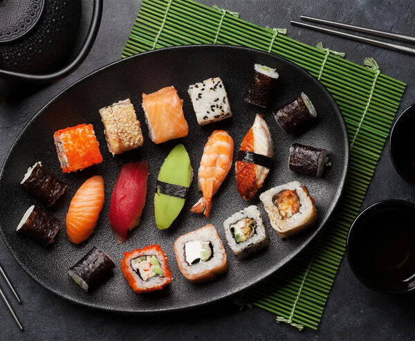 A plate with various pieces of sushi