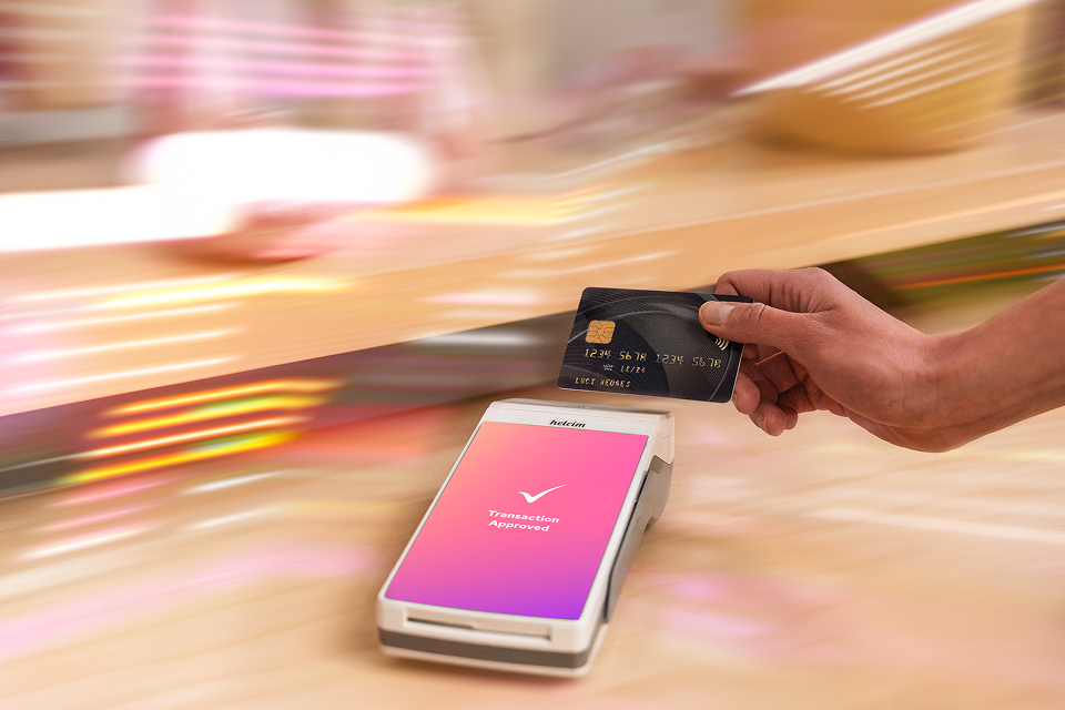 A person making an in-person credit card payment with the Helcim Smart Terminal