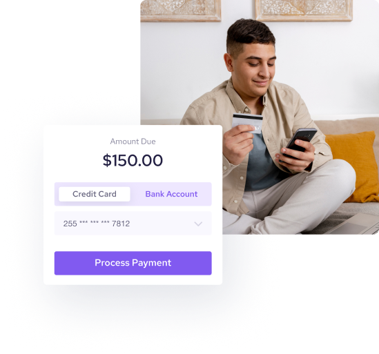 Man has a credit card and phone on the hand