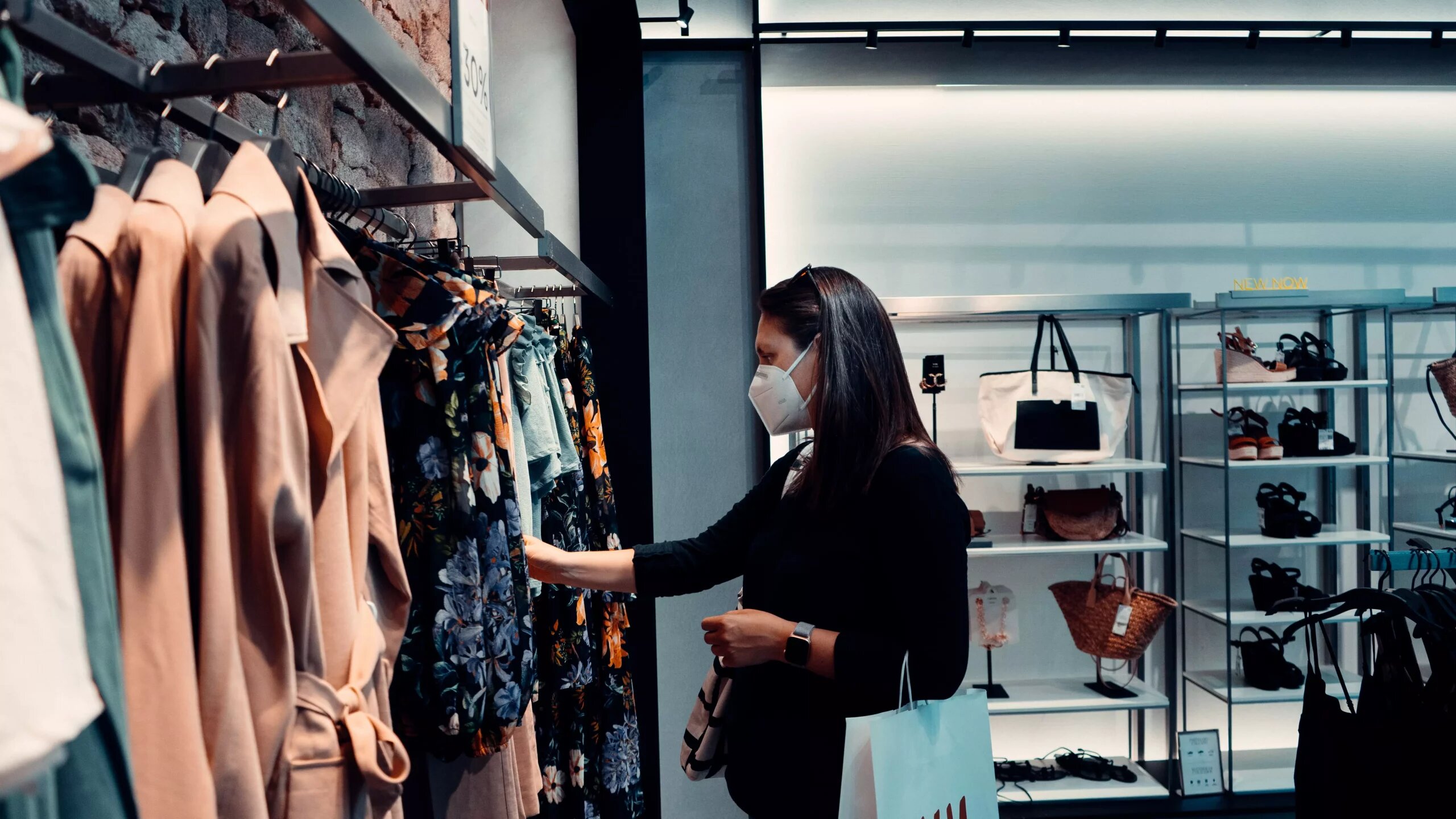 Person shopping for clothes with a mask on